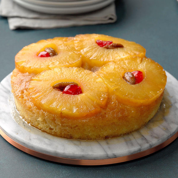 Pineapple Upside Cake! Moist, delicious, light cake with pineapple, Cherries and Raisins makes the perfect dessert to have with a nice hot cup of coffee or tea! Pairs well with Crémas 